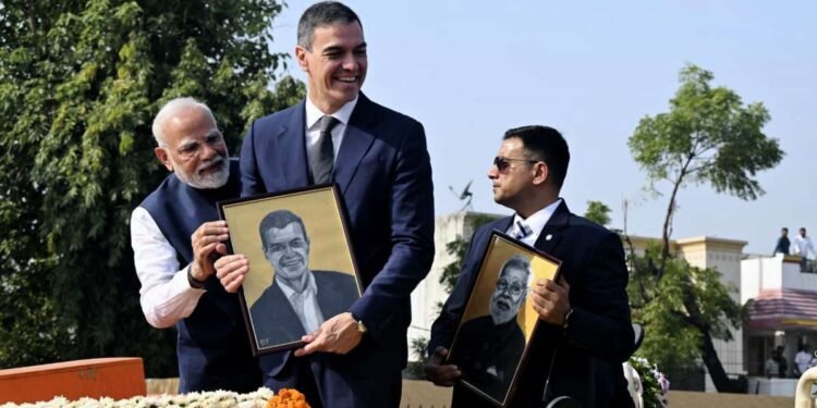Specially abled girl gifts portraits of PM Modi, Pedro Sanchez during roadshow in Vadodara